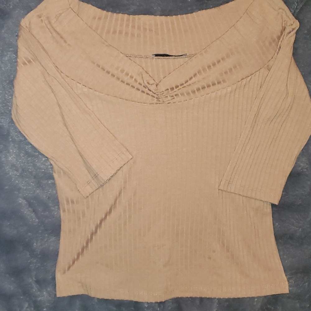 Tan colored Zara shirt.